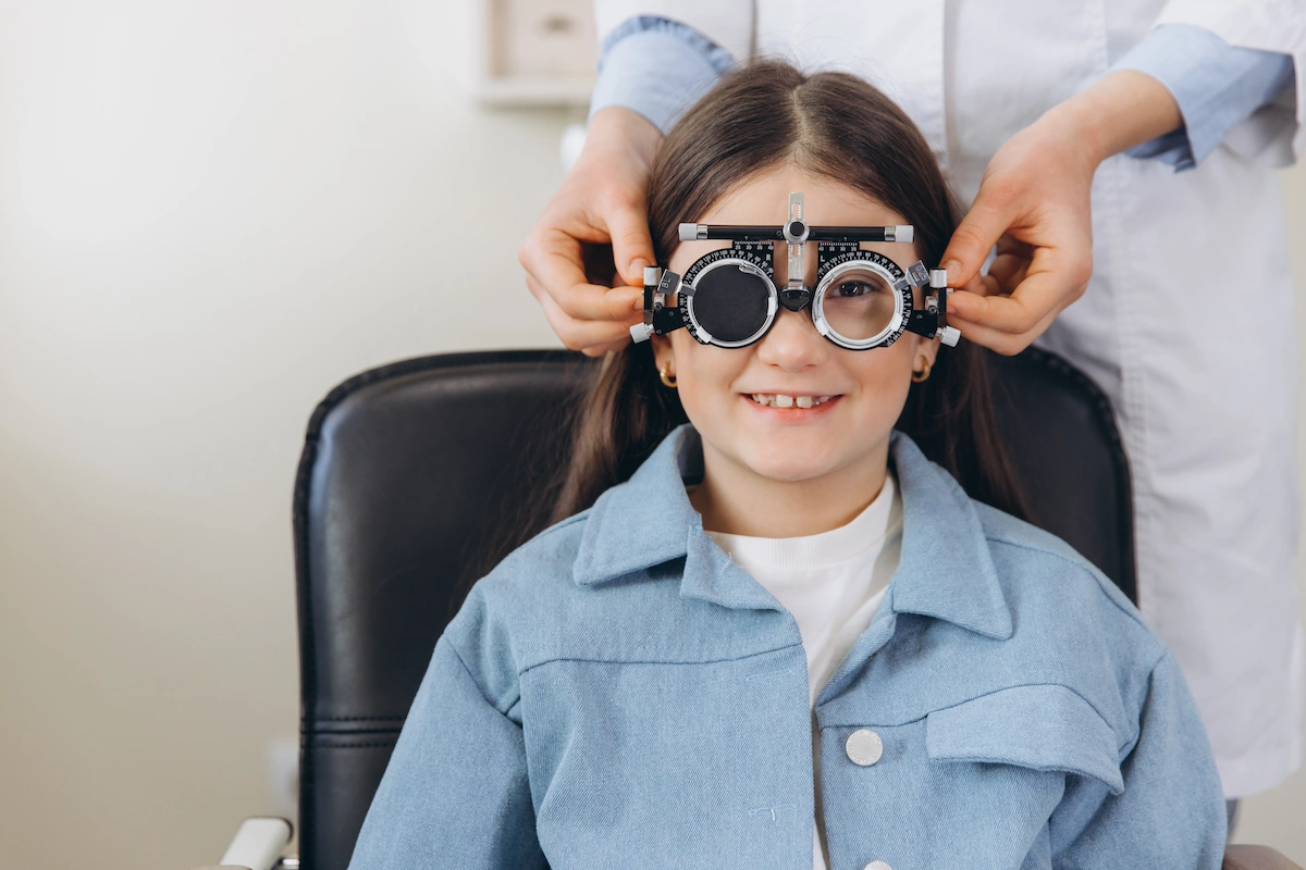 smiling child at pediatric eye exam